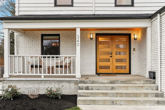 doorway to property featuring a porch