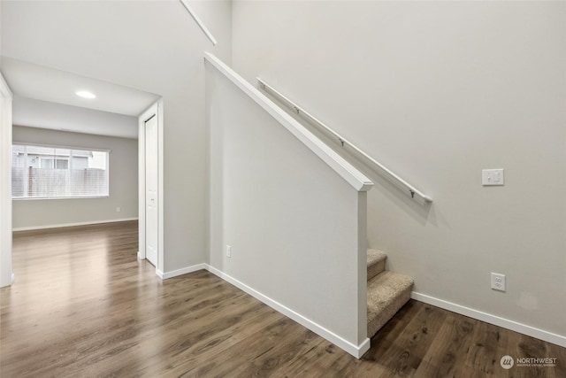 stairs with hardwood / wood-style flooring