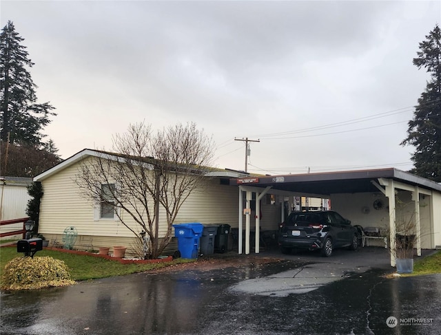 view of side of property featuring a carport