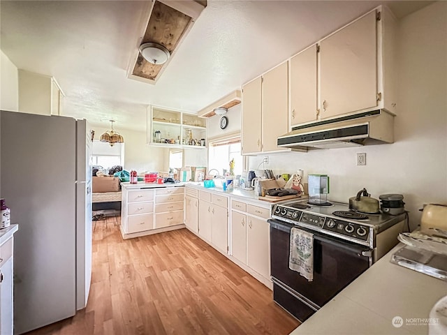 kitchen featuring sink, range with electric cooktop, white refrigerator, light hardwood / wood-style floors, and white cabinets