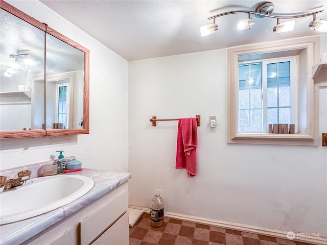 bathroom featuring vanity and a textured ceiling