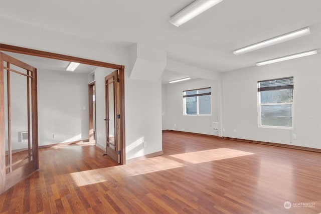 spare room featuring light hardwood / wood-style flooring