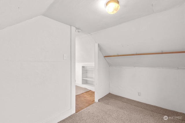 bonus room featuring lofted ceiling