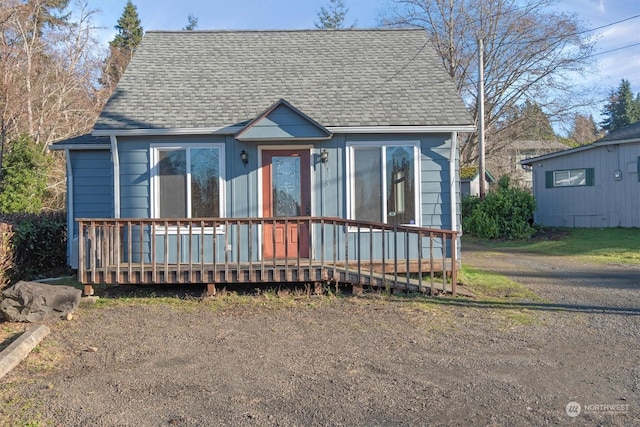 bungalow-style house with a deck