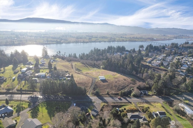 aerial view featuring a water and mountain view