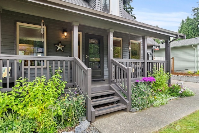 view of exterior entry featuring a porch