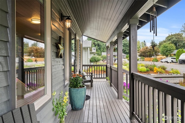 wooden terrace with a porch