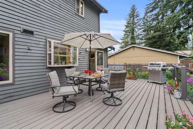 wooden deck with area for grilling