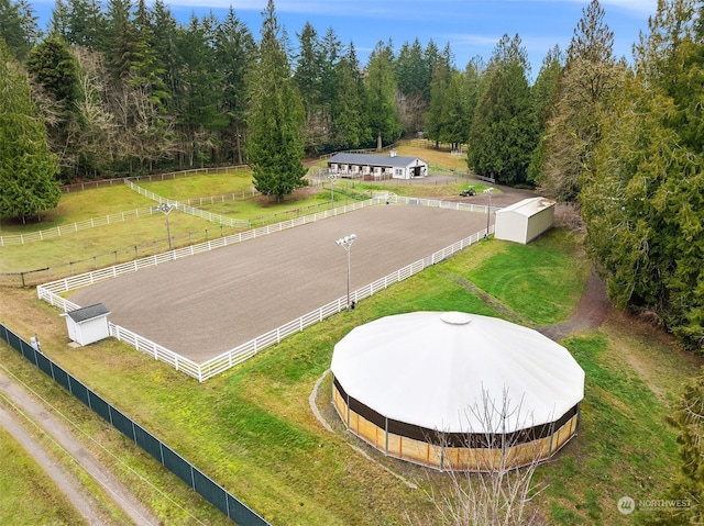 birds eye view of property with a rural view