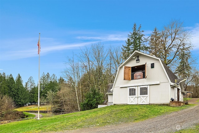 view of outdoor structure with a lawn