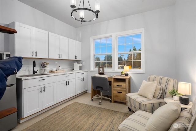 home office with sink and an inviting chandelier