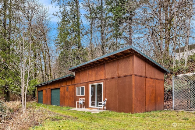 view of outbuilding with a yard