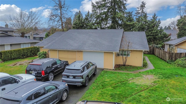 exterior space with a front lawn and a garage