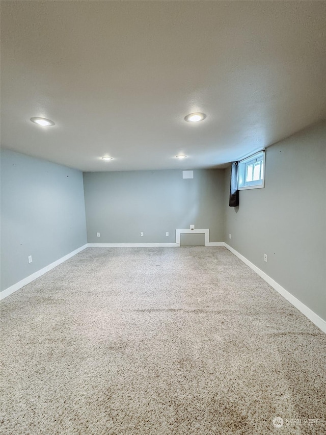 basement featuring carpet flooring