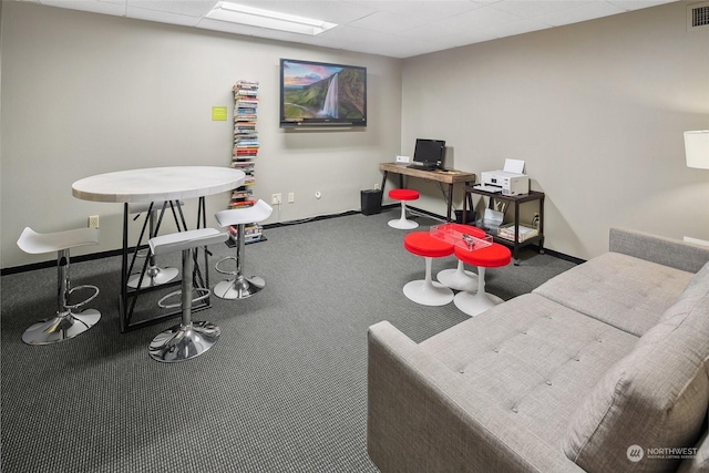 rec room with carpet and a drop ceiling