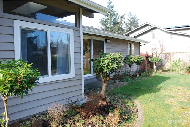 view of property exterior featuring a yard