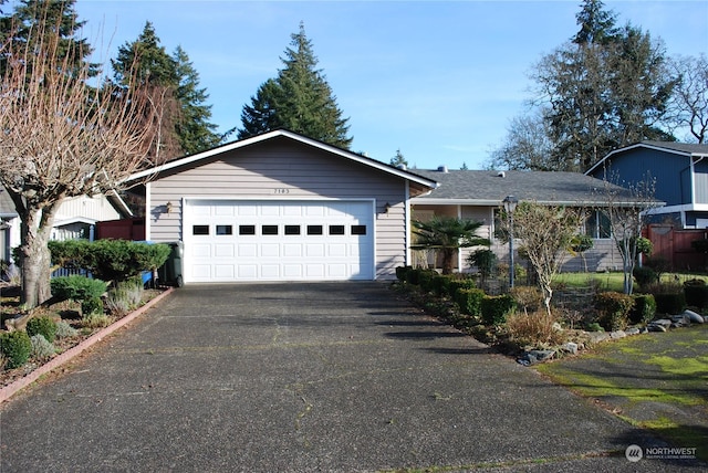 single story home featuring a garage