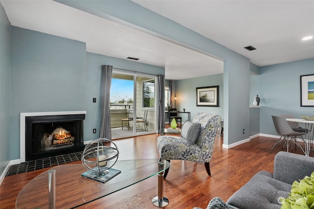 living room with dark hardwood / wood-style flooring