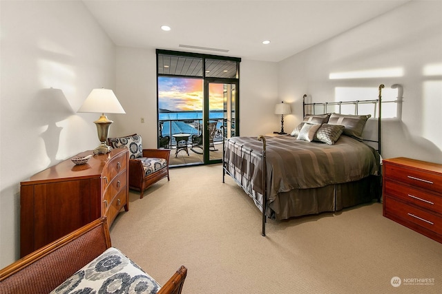 carpeted bedroom featuring access to outside