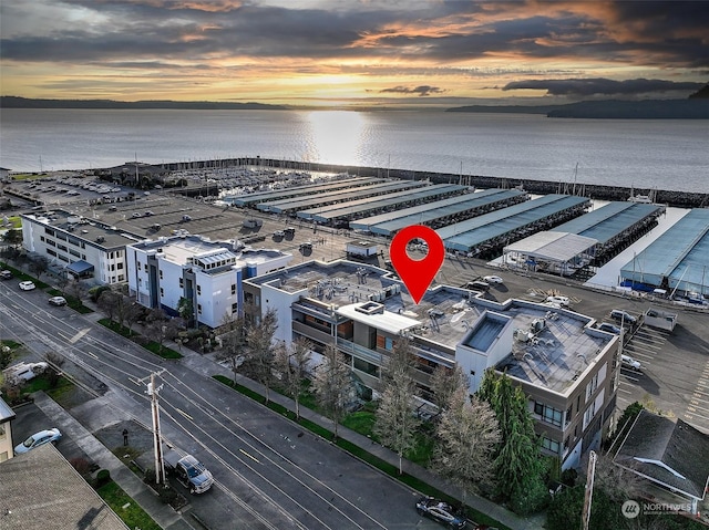 aerial view at dusk with a water view