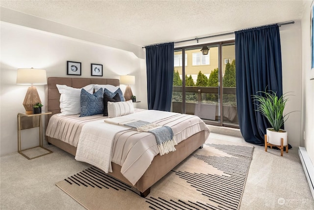 bedroom with floor to ceiling windows, a baseboard heating unit, access to exterior, light colored carpet, and a textured ceiling