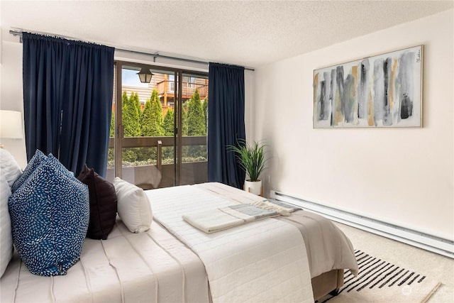 carpeted bedroom featuring a baseboard heating unit, access to exterior, and a textured ceiling