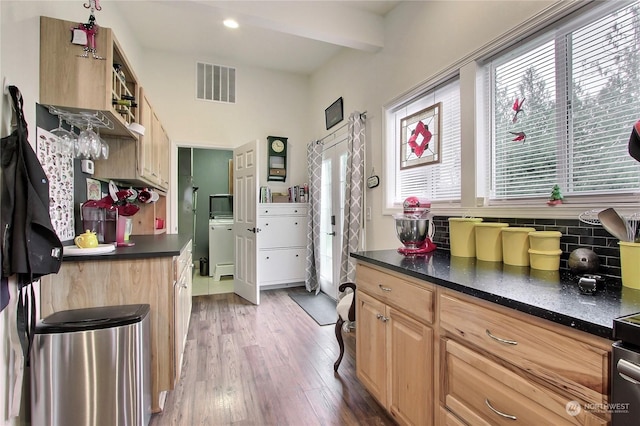 kitchen featuring hardwood / wood-style flooring, light brown cabinets, and beam ceiling