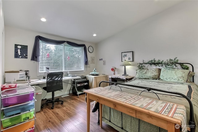 bedroom with hardwood / wood-style floors