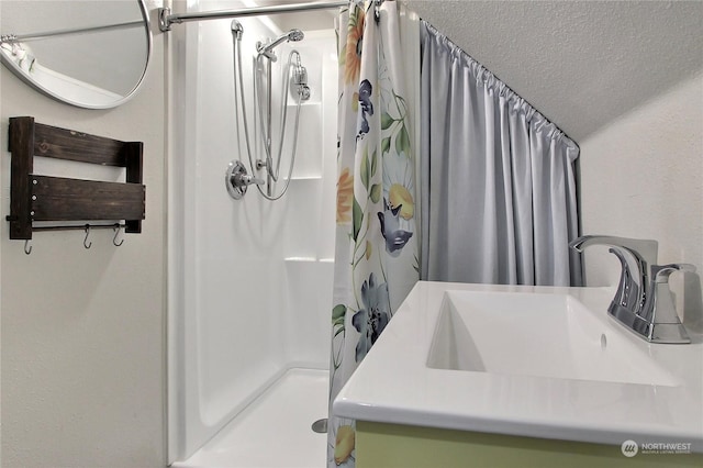 bathroom with a shower with shower curtain and sink