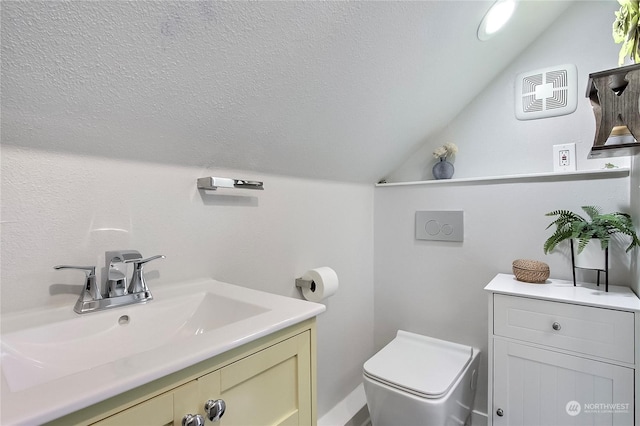 bathroom featuring toilet, vanity, and lofted ceiling