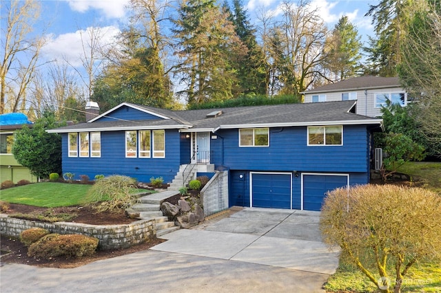 single story home with an attached garage and driveway