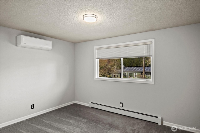 empty room featuring baseboards, dark colored carpet, a textured ceiling, a baseboard heating unit, and a wall mounted AC