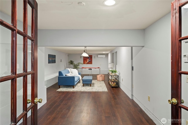 unfurnished living room featuring dark wood-type flooring