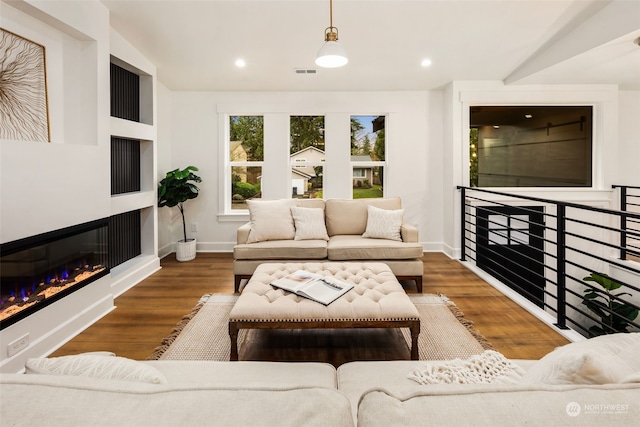 living room featuring dark wood-type flooring