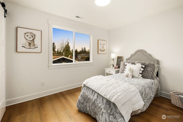 bedroom featuring hardwood / wood-style floors