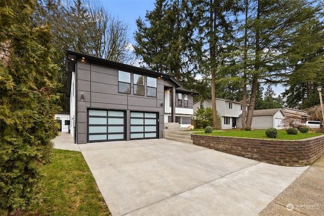 view of front facade featuring a garage and a balcony