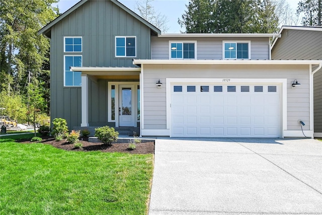 view of front of house featuring a garage and a front yard