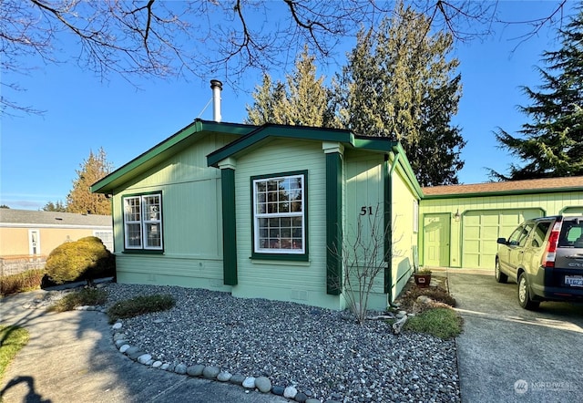 view of side of home with a garage