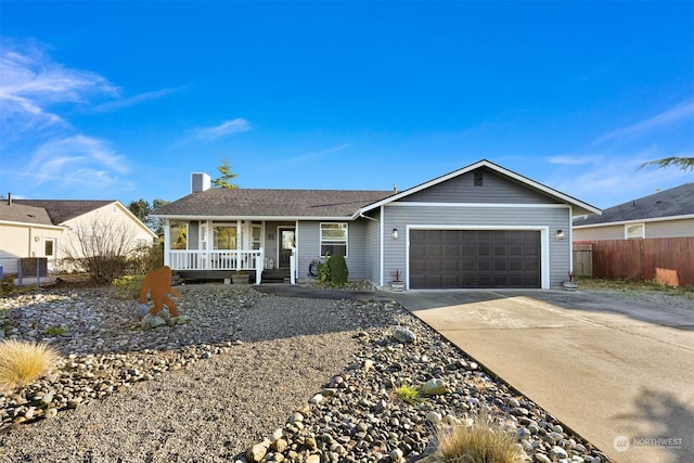 single story home with a porch and a garage