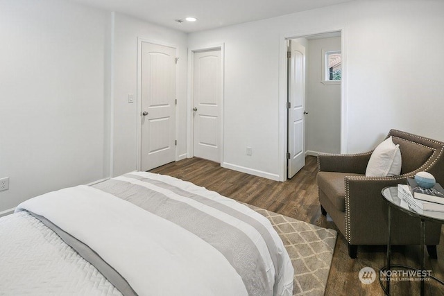 bedroom featuring a closet and dark hardwood / wood-style floors