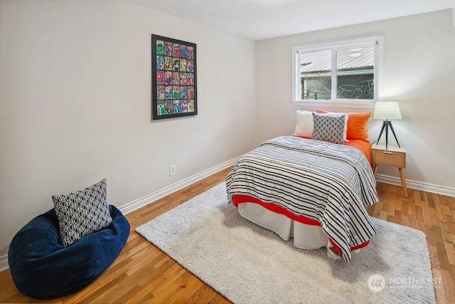 bedroom with hardwood / wood-style floors