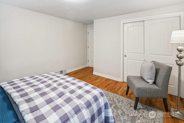 bedroom featuring a closet and hardwood / wood-style floors