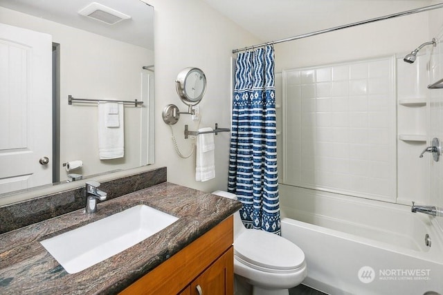 full bathroom with toilet, shower / bath combination with curtain, and vanity