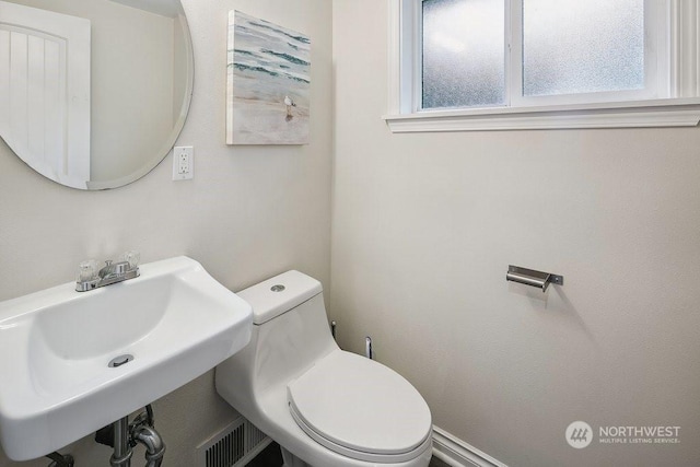 bathroom with toilet and sink