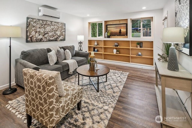 living room featuring dark wood-type flooring and a wall unit AC