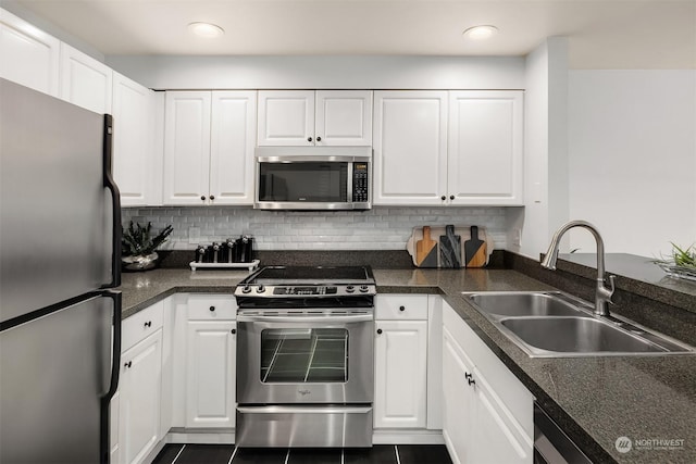 kitchen featuring sink, white cabinets, and stainless steel appliances