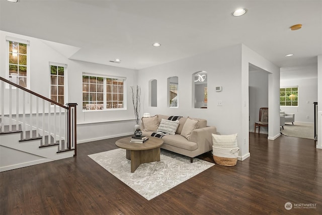 living room with dark hardwood / wood-style flooring