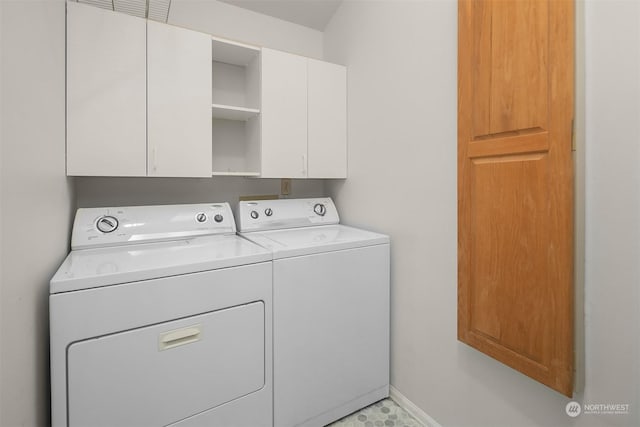 laundry room featuring cabinets and independent washer and dryer