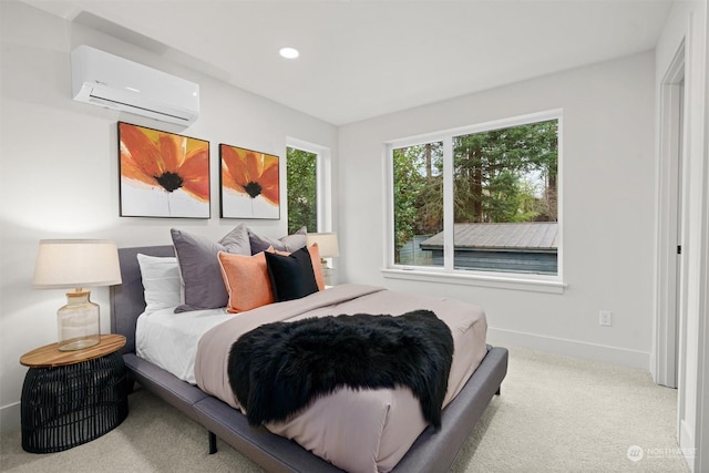 bedroom featuring light colored carpet and a wall mounted air conditioner