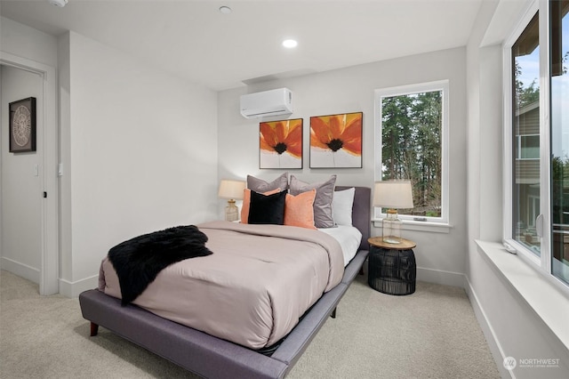 carpeted bedroom featuring a wall mounted AC